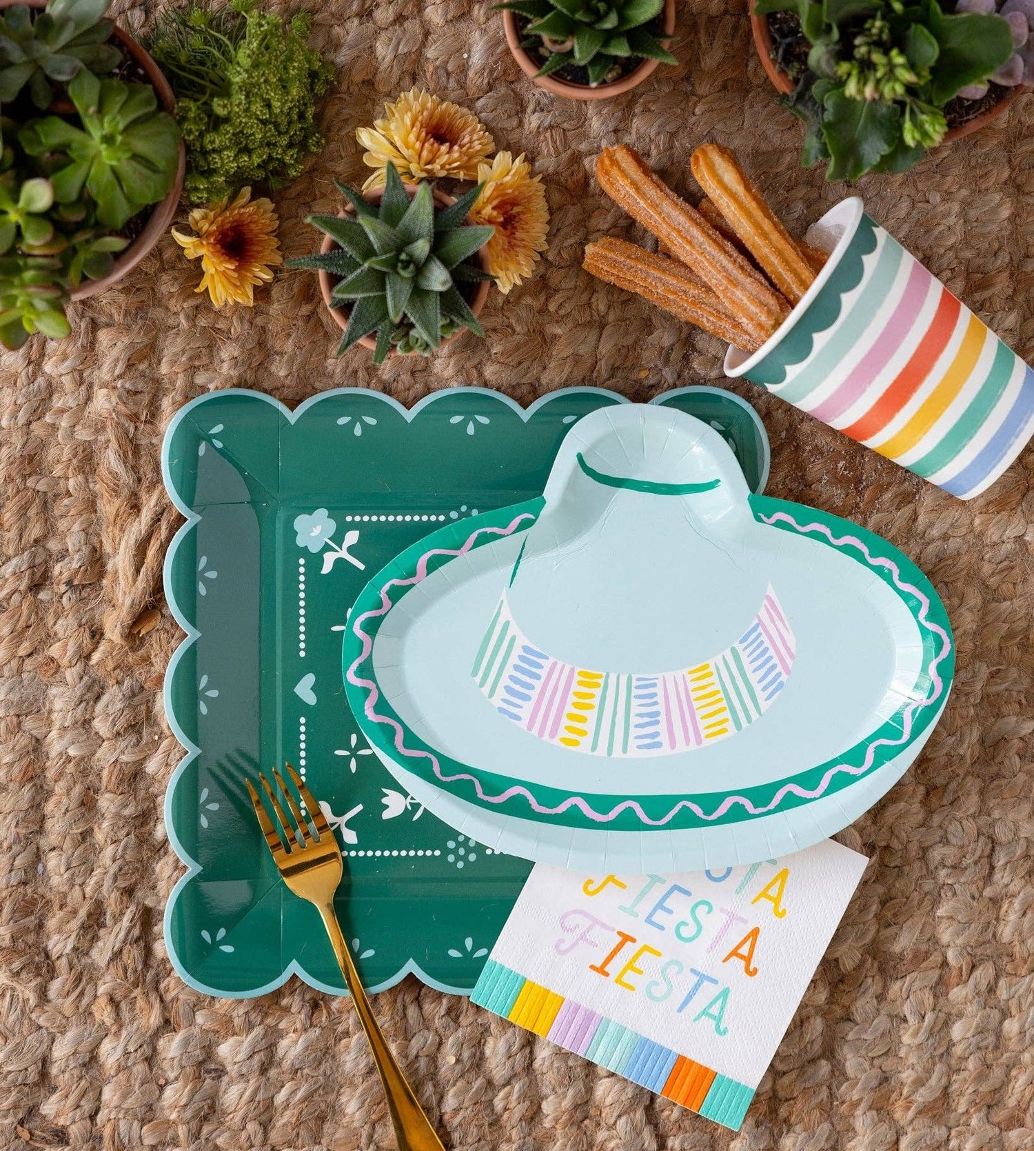 Fiesta Taco Party Table Decor with Taco Truck plates and corresponding avocado and taco die-cut napkins
