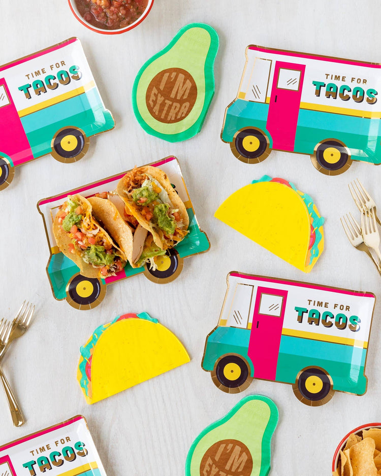 Fiesta Taco Party Table Decor with Taco Truck plates and corresponding avocado and taco die-cut napkins