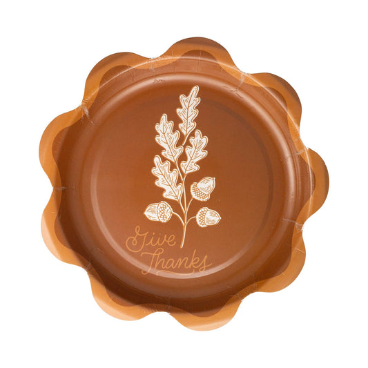 Brown decorative plate with 'Give Thanks' text and leaf design with scalloped edge trim.