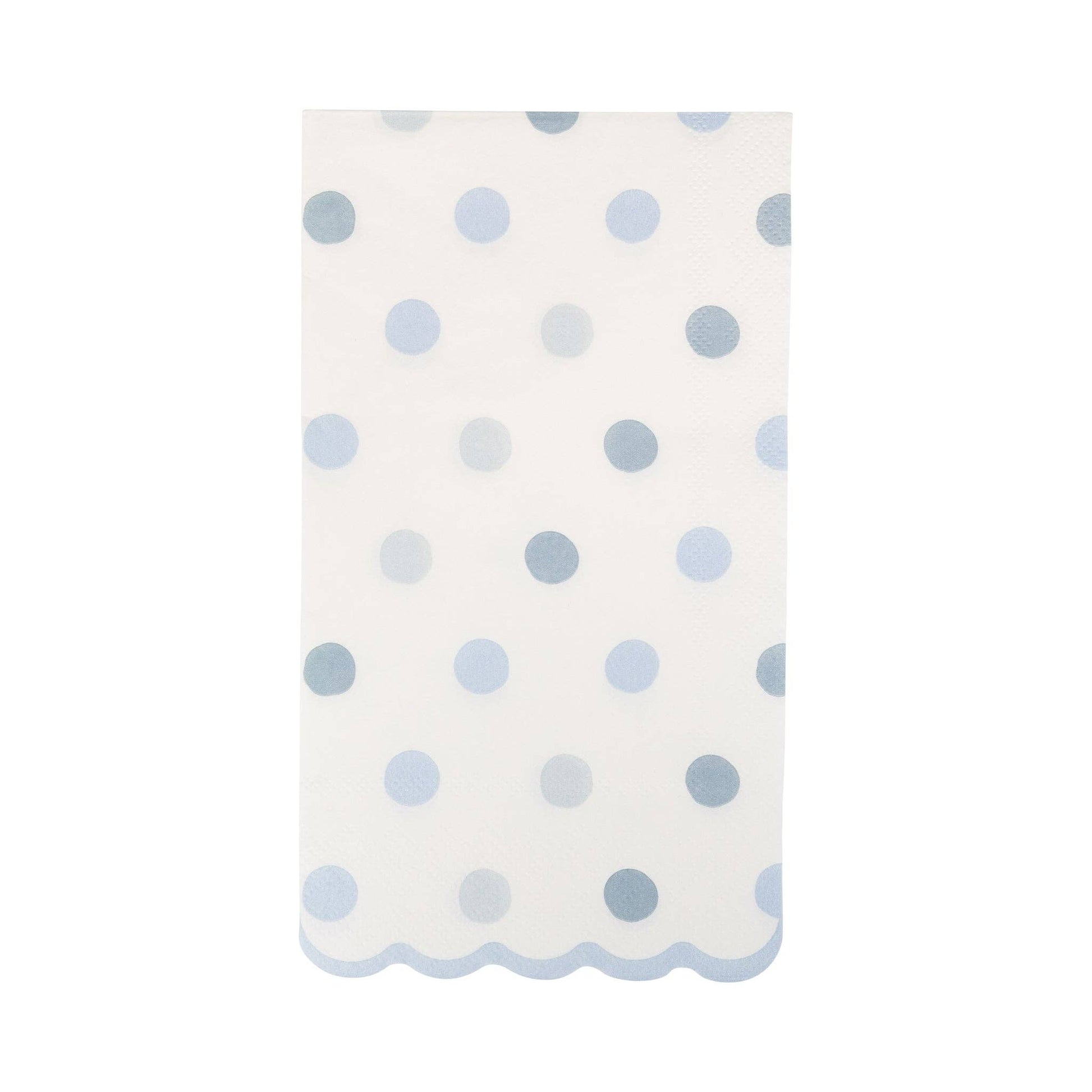 White guest towel napkin with blue polka dots on a white background