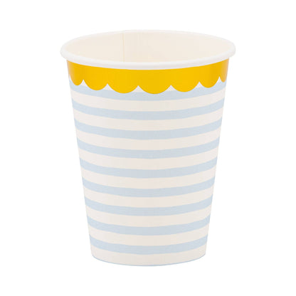 Paper cup with blue and white stripes and gold foil scalloped rim on a white background.