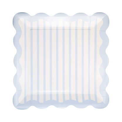 Decorative plate with scalloped edge and blue and white striped pattern on a white background.