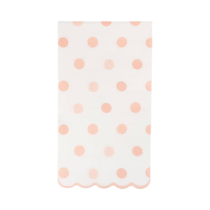 Guest towel paper napkin with pink polka dots on a white background