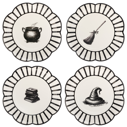 Four round decorative plates, each with a scalloped edge, black-and-white striped border, and a black witch-themed illustration in the center: a cauldron, broom, stack of books, and witch hat.