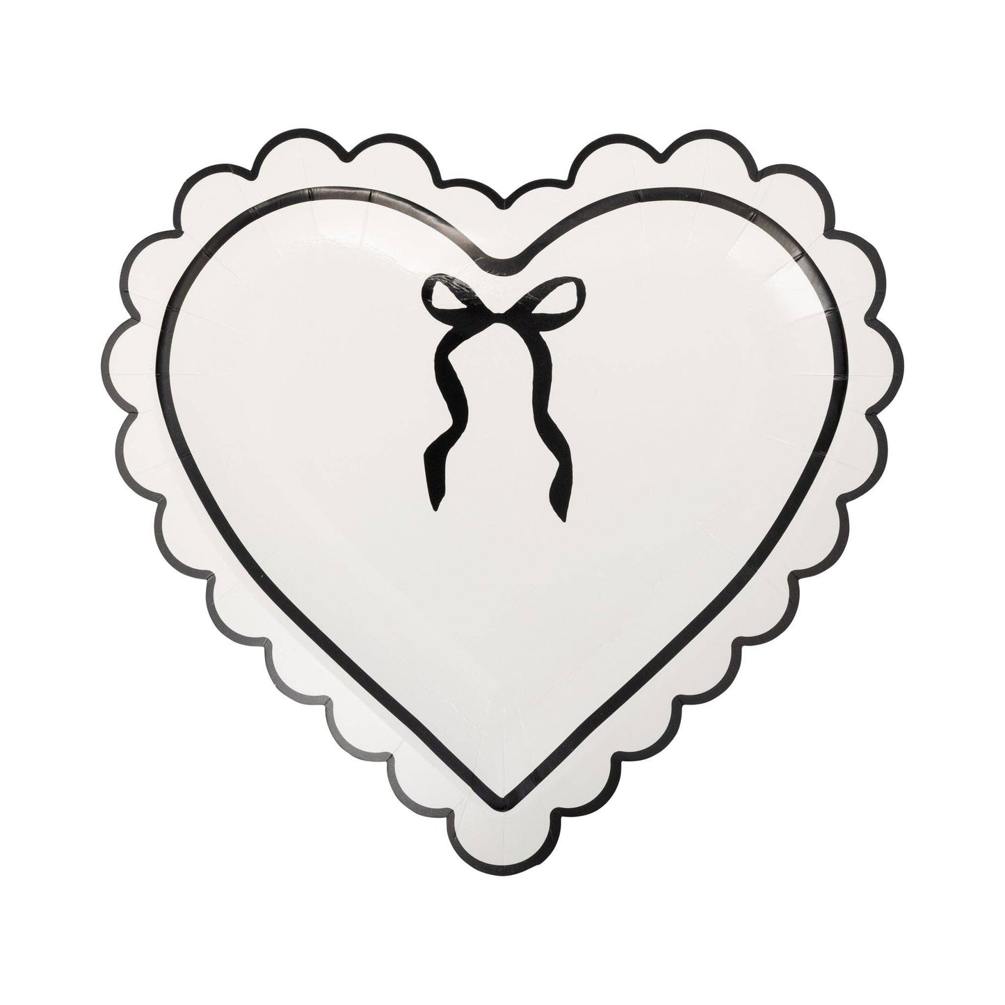 Cream colored heart-shaped paper plate with a black bow design and scalloped edges on a white background.
