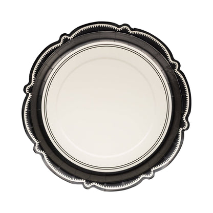 White decorative paper plate with intricate black bracket border.