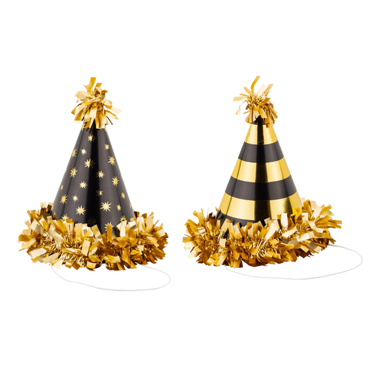 Two black and gold party hats with gold fringe.