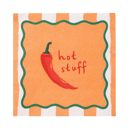 Napkin with red chili pepper and 'hot stuff' text on orange and white striped background
