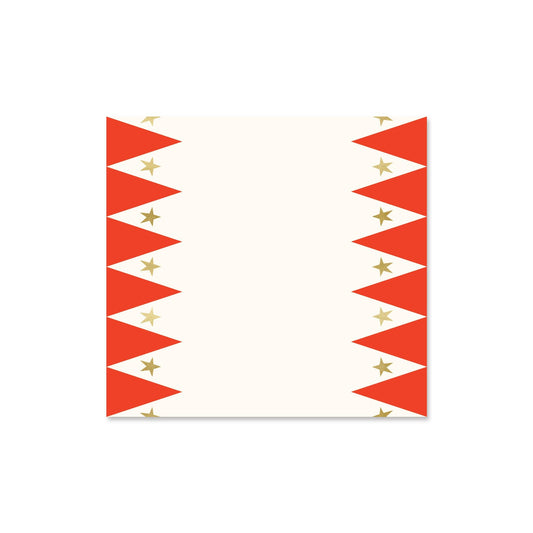 Paper table runner with a carnival print, featuring gold foil stars, in red and white colors.