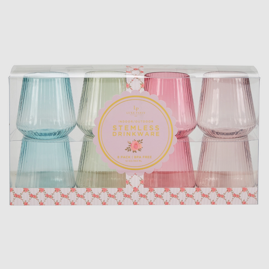 Set of four colorful stemless plastic cups in a decorative box with a floral pattern.