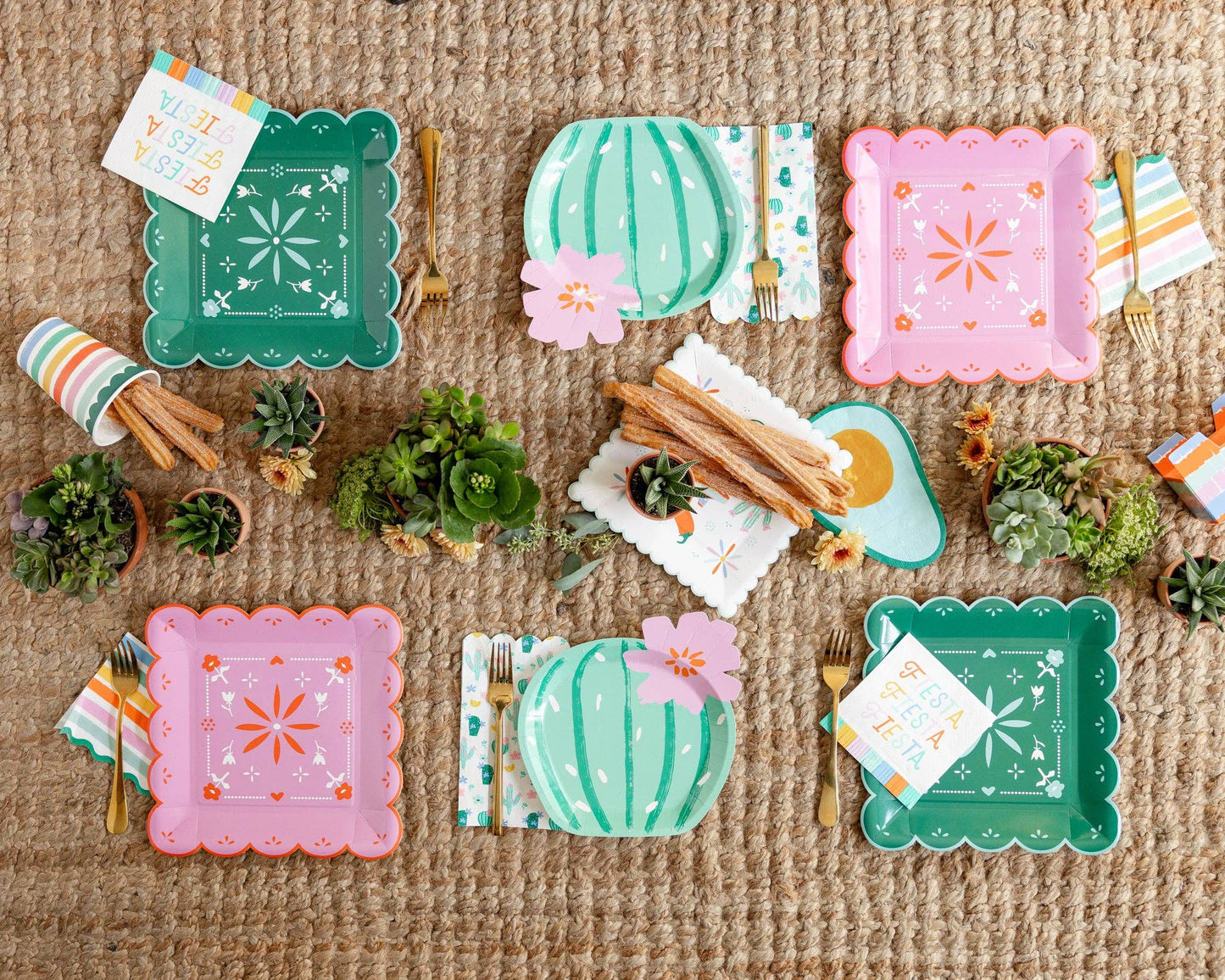 Colorful paper plates with decorative fiesta designs on a textured surface.