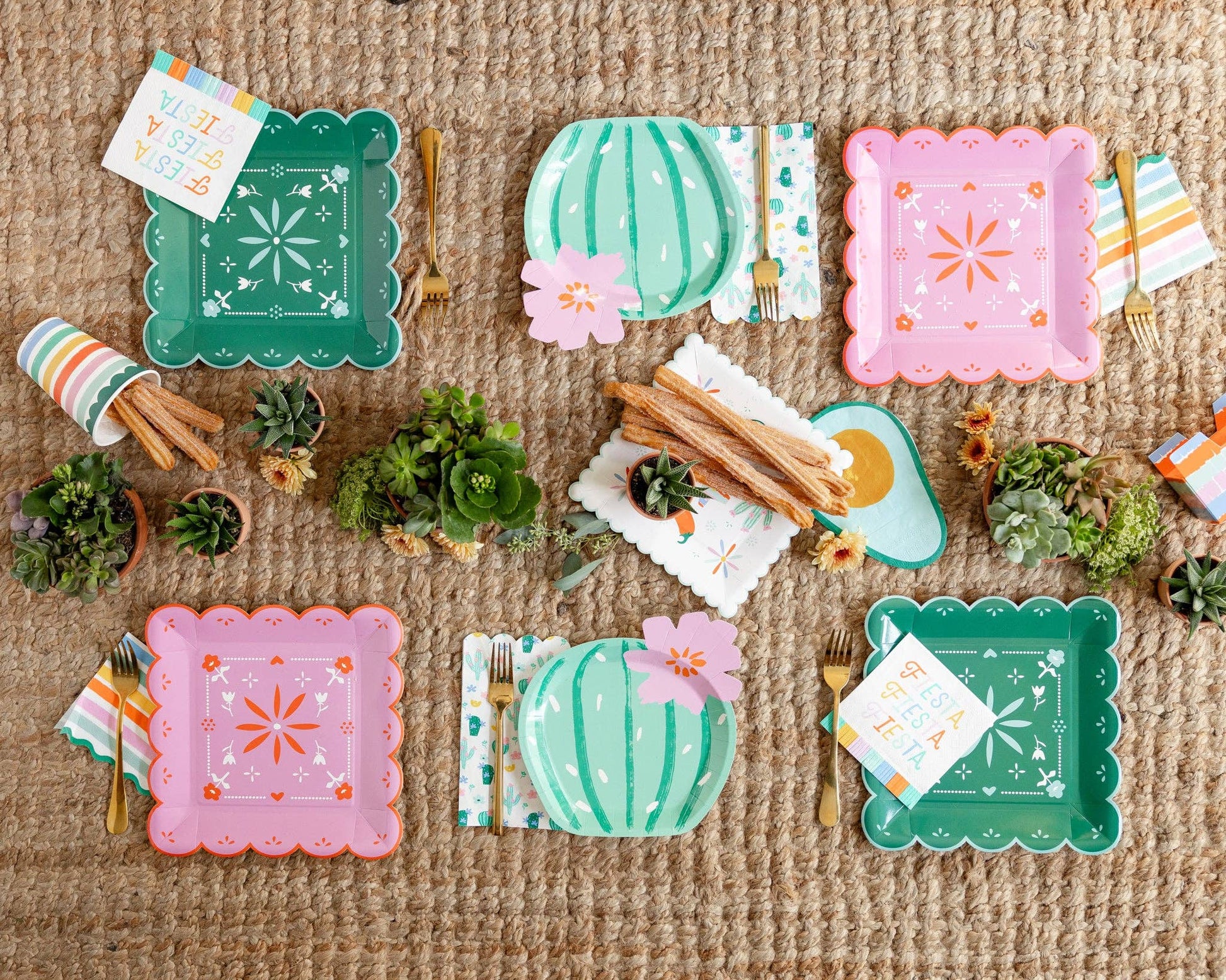 Colorful paper plates with decorative fiesta designs on a textured surface.