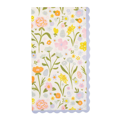 Floral patterned paper dinner napking with colorful flowers on a white background.