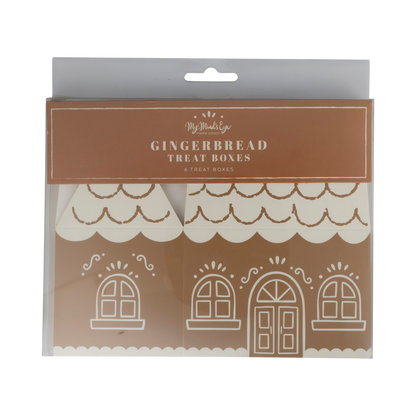 A package of Gingerbread Treat Boxes, featuring three white gingerbread house-shaped boxes inside a clear plastic sleeve with a brown header card.