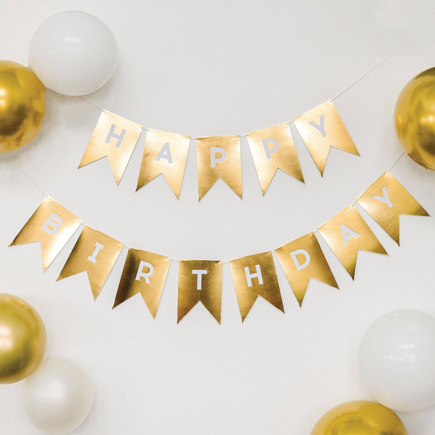 Gold 'Happy Birthday' banner with balloons on a white background