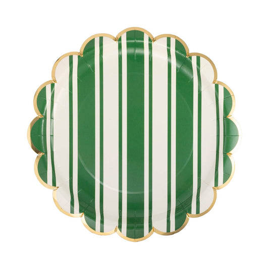 Decorative plate with green and white vertical stripes on a white background
