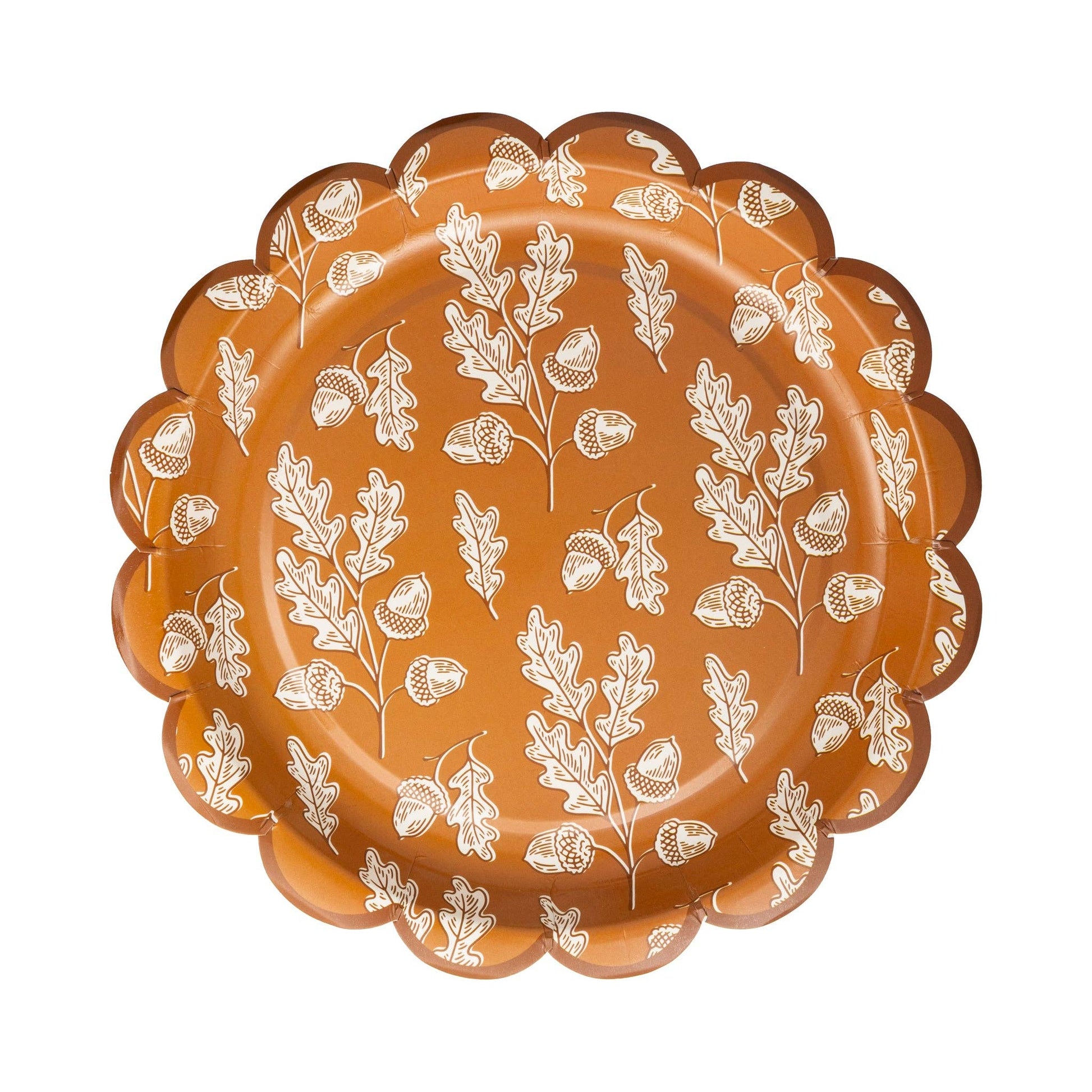 Decorative plate with white leaf and acorn design on an orange & brown background.