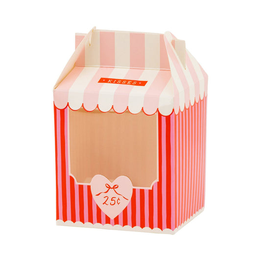 Red and pink striped treat box shaped like a Kissing Book with a heart sign with 25 cents referenced.  Top is pink and white striped to look like an awning with folding sides and text: "KISSES".