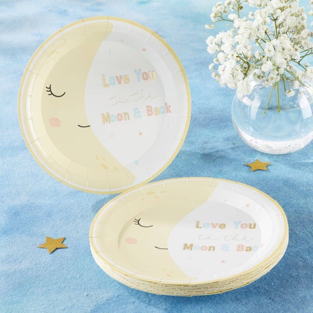Paper plates with a smiling crescent moon design and 'Love You to the Moon & Back' text on a blue surface with flowers.