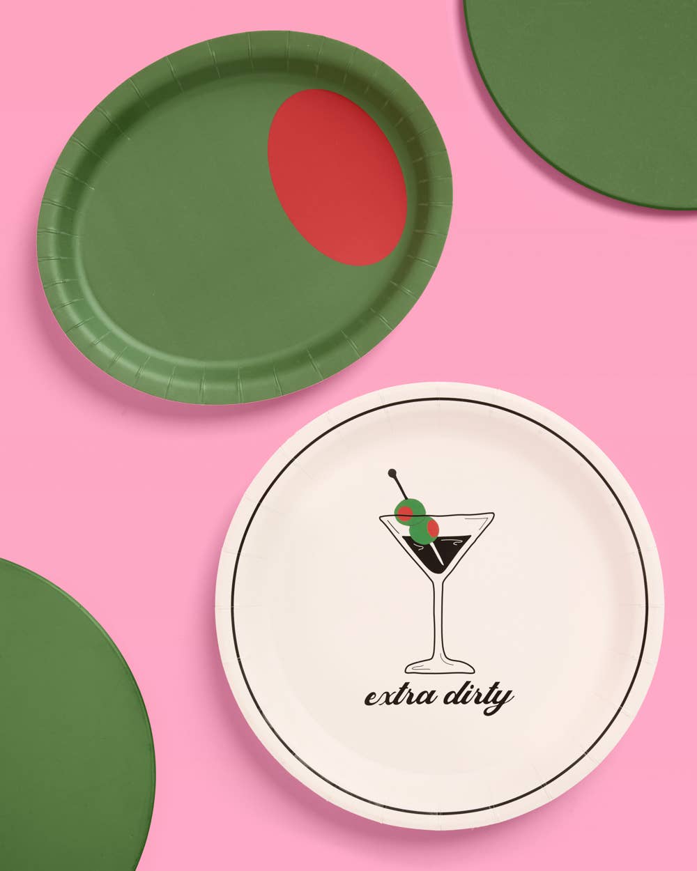 Green paper plates with red to look like an olive and white plate with cocktail graphic and the text "extra dirty" on pink background.