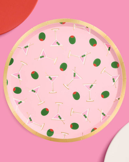 Decorative paper plate with cocktail and strawberry pattern on a pink background