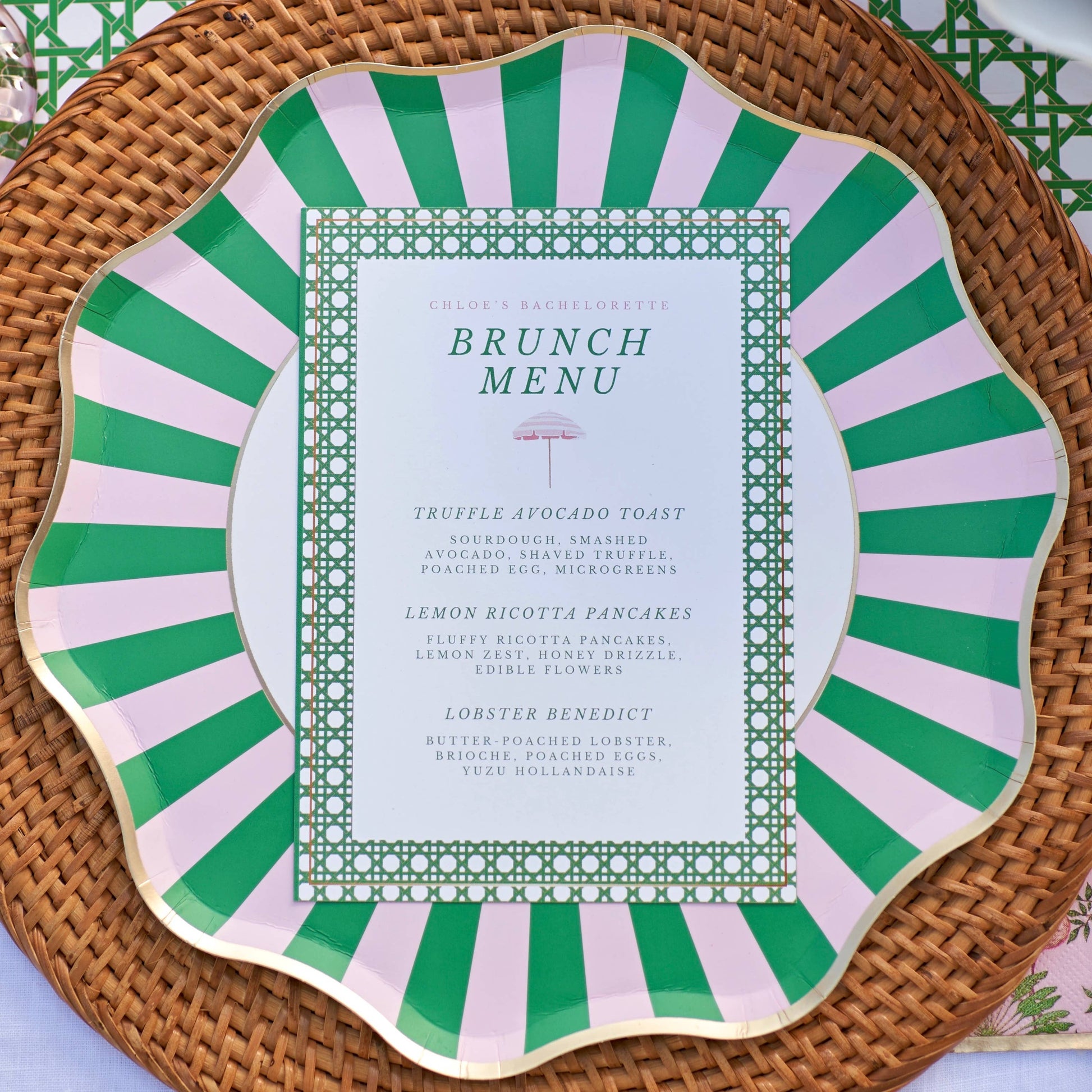 Brunch menu on a decorative paper plate with green and pink striped border