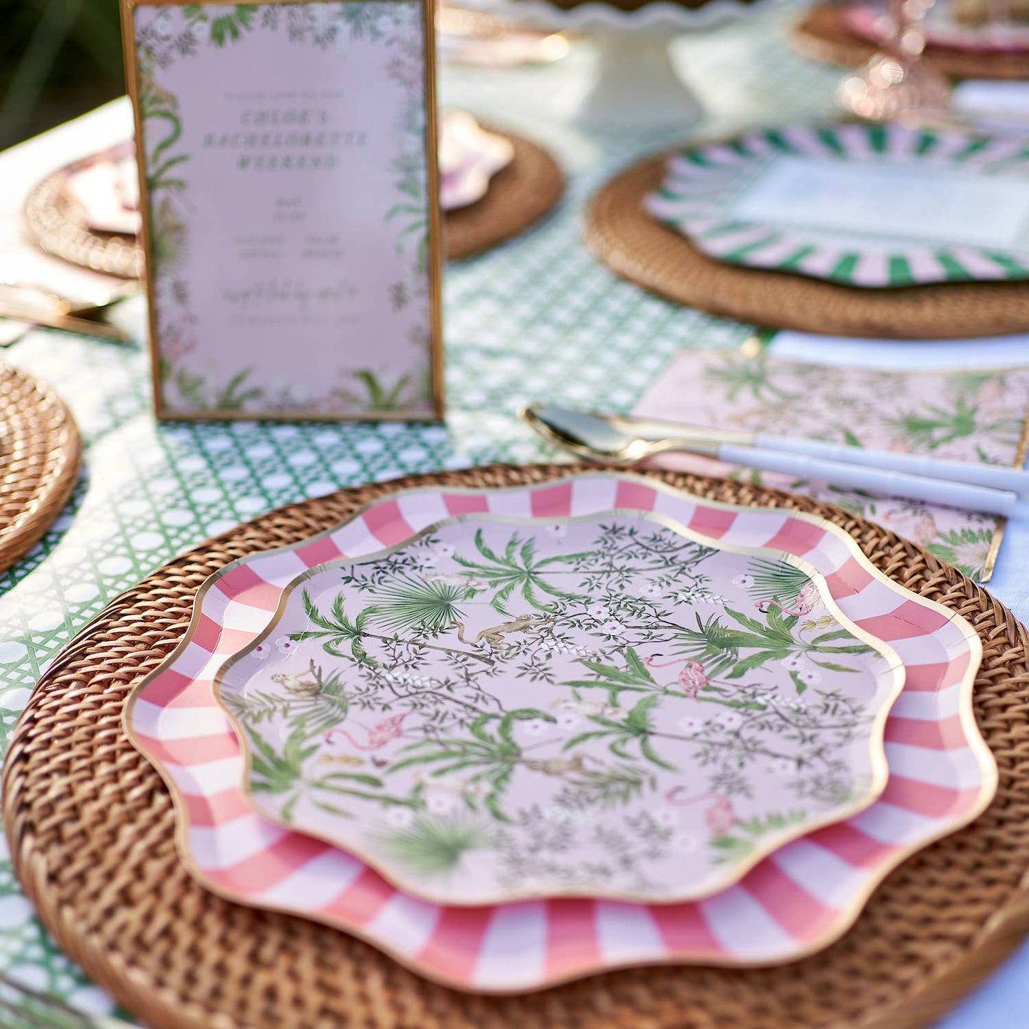 Decorative plates with tropical patterns on a table setting.