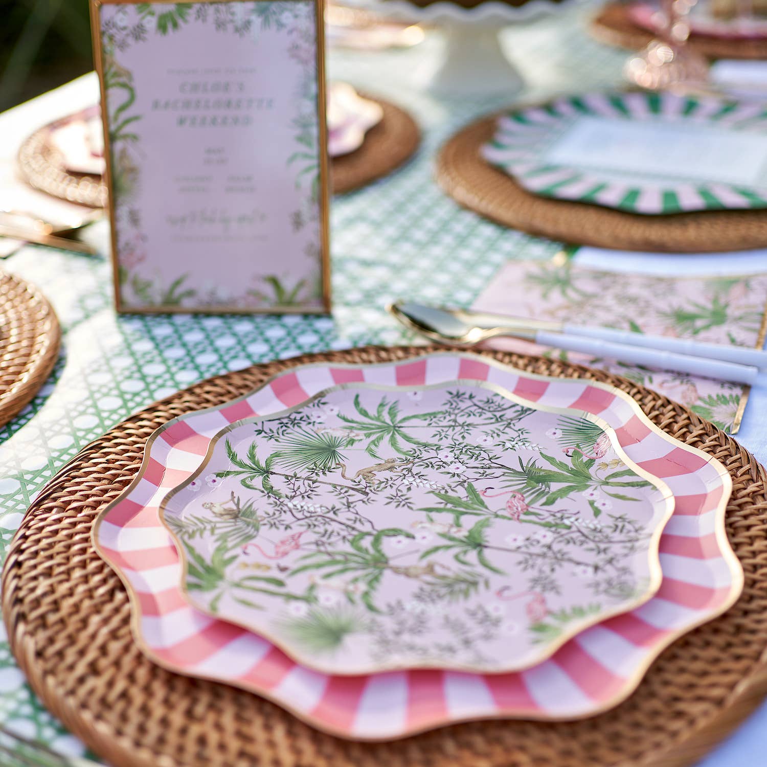Decorative plates with tropical patterns on a table setting.