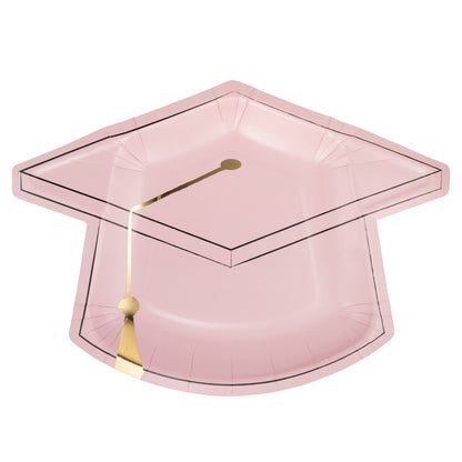Pink graduation cap shaped plate with gold tassel on a white background