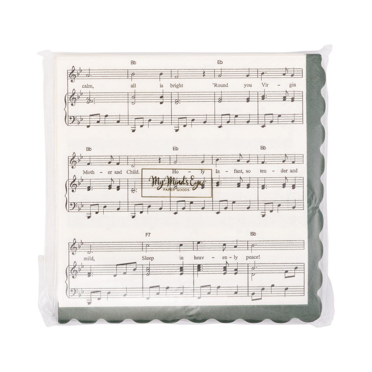 A square beverage napkin designed with sheet music print of "Silent Night" with a scalloped dark green border in clear plastic packaging.