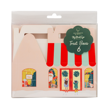 Pack of 6 paper craft treat boxes shaped like Christmas storefronts, in clear plastic packaging with a green paper label that reads 'occasions MyMaker craft supplies Treat Boxes 6'.