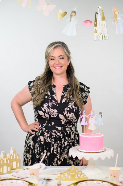 Trés Chic Party Boutique Owner, Heather Ficquette, standing among styled Princess Party Set.