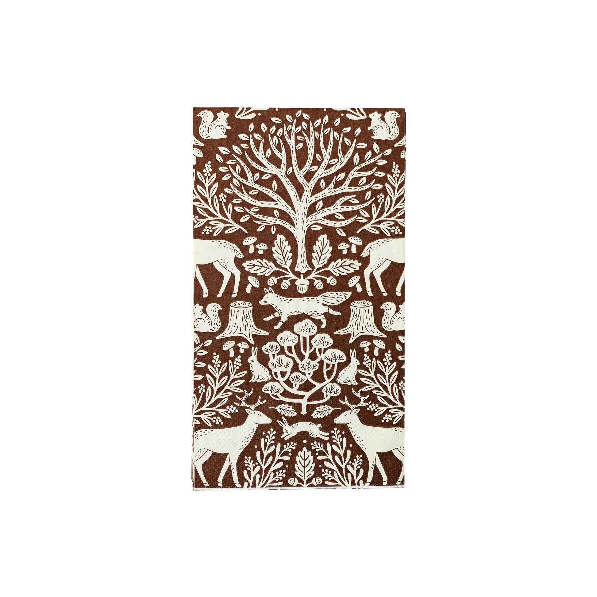 Patterned paper guest towel napkin with forest animals and trees on a brown background.