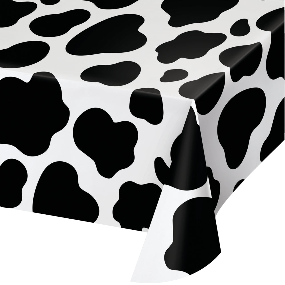 A plastic tablecloth with a cow print pattern.
