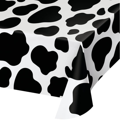 A plastic tablecloth with a cow print pattern.