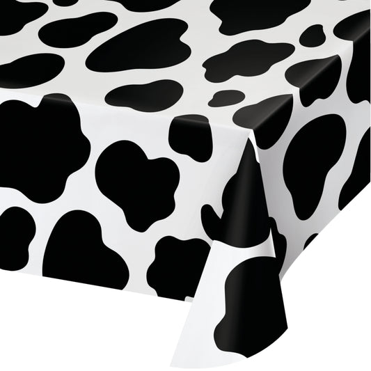 A plastic tablecloth with a cow print pattern.