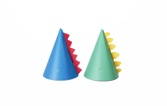 Two party hats with dinosaur motifs in blue and green colors.