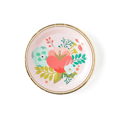 A 7-inch round paper plate with a floral design in the center, featuring gold foil accents along the rim.