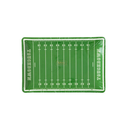 A paper plate with a green football field design including yard lines and the text 'Touchdown'.