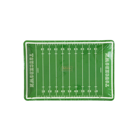A paper plate with a green football field design including yard lines and the text 'Touchdown'.