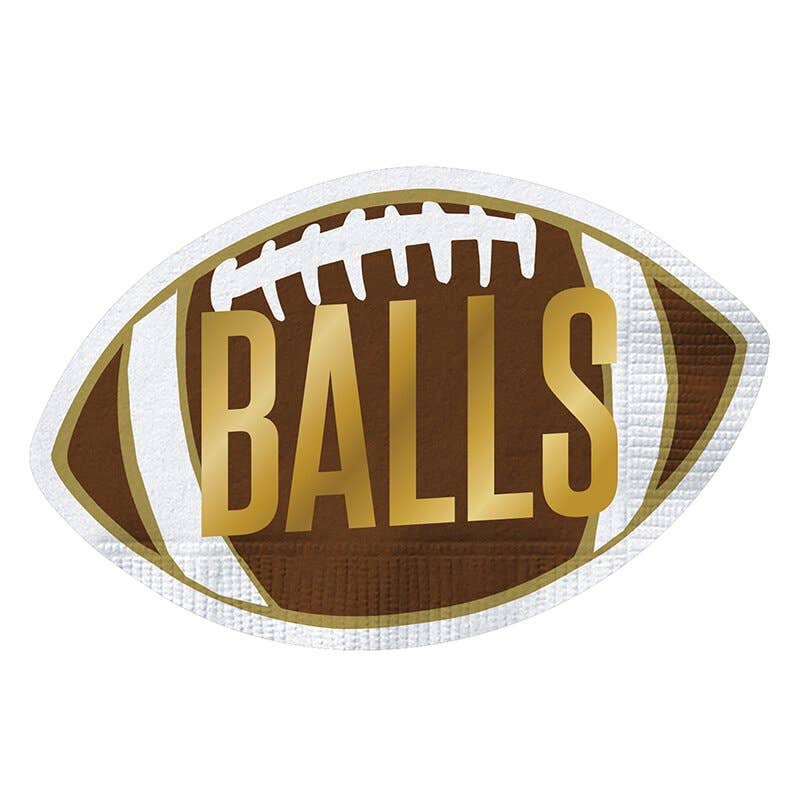 A die-cut party napkin with a football shape and the word 'BALLS' printed in the center.