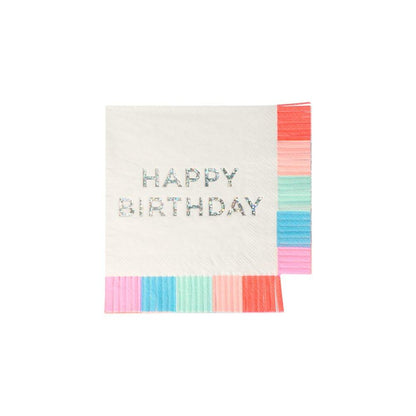 A napkin with a 'Happy Birthday' message in silver sparkle foil detail, framed by a colorful fringe edge.