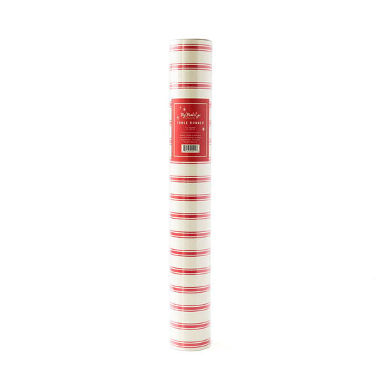 A rolled up red and white striped paper table runner with product label visible.