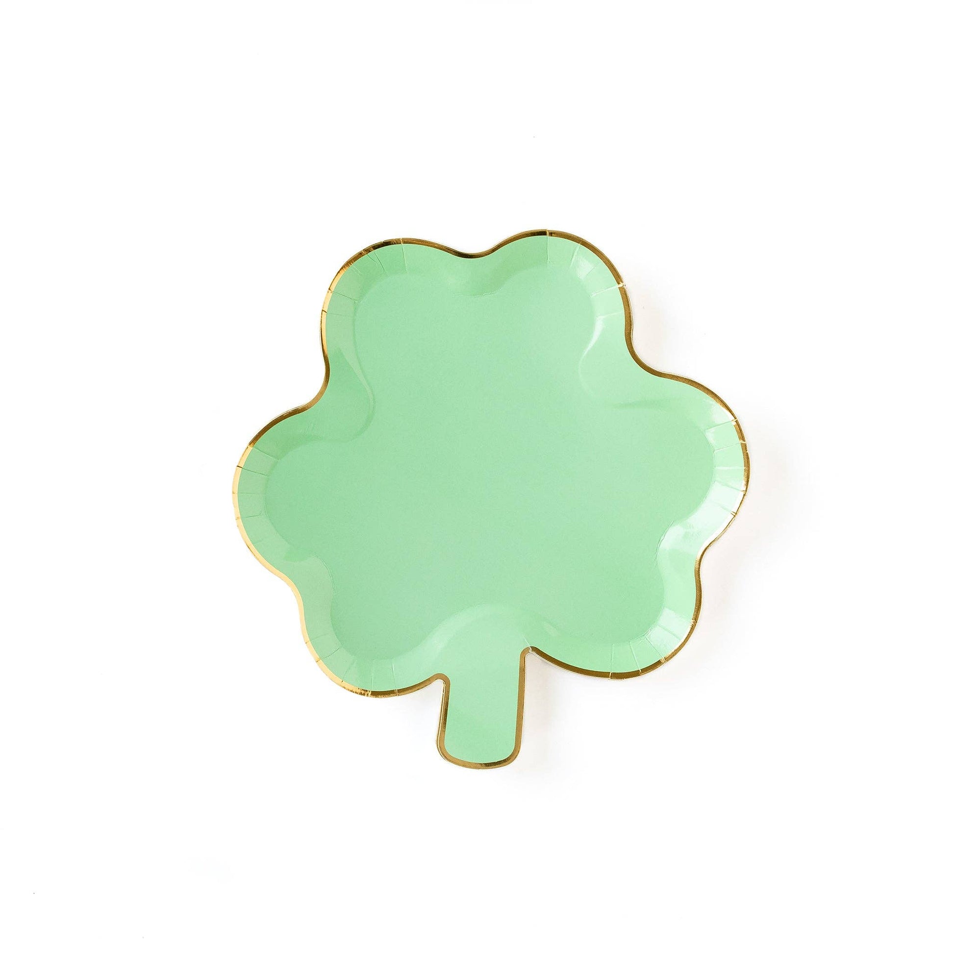A shamrock-shaped green plate with gold foil edging.