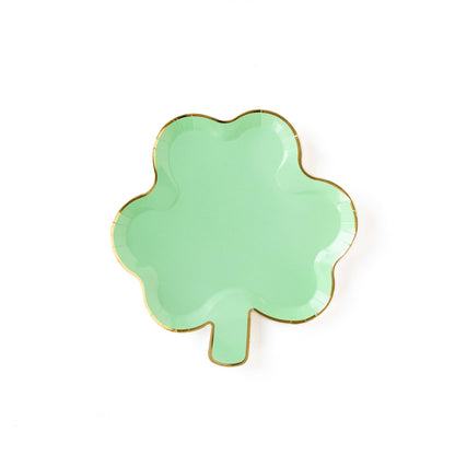 A shamrock-shaped green plate with gold foil edging.