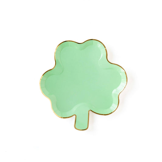A shamrock-shaped green plate with gold foil edging.