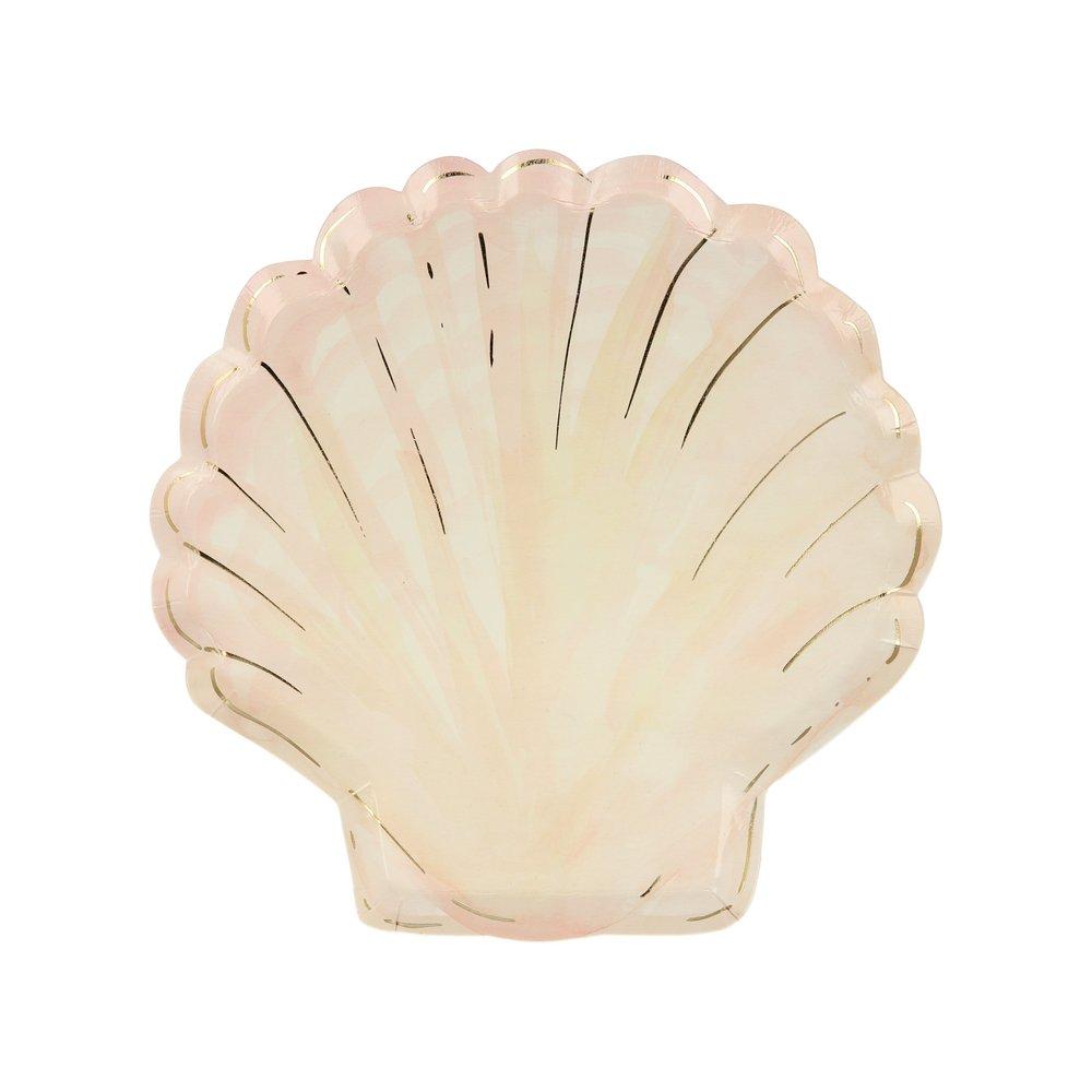 A plate designed to look like a clam shell with gold foil details.